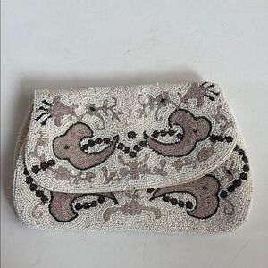 Antique 1920s Made in France cream beaded clutch silk interior. Cream brown pink